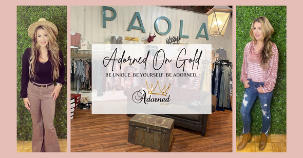 Welcome to Adorned on Gold Boutique | Located in Paola, Kansas | Image of inside of store front and two models |